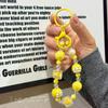 El nuevo llavero creativo de cuentas está pintado a mano, es una bolsa de cuentas, un pequeño colgante, una funda para teléfono móvil, una cadena colgante, una pequeña y fresca cadena para teléfono móvil.