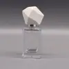 Botella de perfume premium de 30ML tapa de poliedro irregular botella sub-perfume portátil botella de spray cosmético de vidrio
