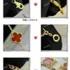 Collar de trébol de cuatro hojas de oro V de alta gama para mujer, colgante de ágata nácar tallado por CNC, trébol de la suerte de doble cara, cadena ligera de lujo para la clavícula para mujer
