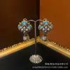 Antiguo estilo occidental bañado en cobre con oro retro de 18 quilates lujoso hermoso esmalte colorido tallado con pendientes de perlas trabajo pesado nicho lujo ligero