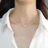 Collar de perlas apiladas de doble capa para mujer, elegante collar de nicho con diseño de alto nivel, cadena de clavícula, nuevas explosiones 2023