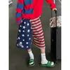 Pantalones acampanados cropped de estilo retro americano con estampado de estrellas y bloques de color para hombre y mujer, diseño holgado y versátil, adecuados para parejas, azul