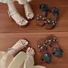 Sandalias de tiras cruzadas con flor de pedrería para mujer, nuevo estilo de hada de verano, adecuadas para combinar con faldas, con tacones de aguja, zapatos de estilo romano