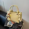 Bolsa de Mão Tendência Transfronteiriça com Textura de Pedra para Mulheres 2025 Nova Versão Coreana Luxo Leve Nicho de Alta Qualidade Bolsa de Ombro Único Transversal
