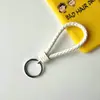 Llavero creativo de cuerda de cuero tejido a mano para pareja, llavero de coche, llavero al por mayor, colgante para bolso