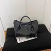 Bolso de Hombro Tejido de Moda Europeo y Americano 2026 Verano Nuevo Casual Gran Capacidad para Viajes Cotidianos Versátil Elegante Versión Coreana para Mujer