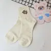 Meias meias de cano médio ins da moda versátil versão japonesa coreana outono inverno desenho animado fofo estilo acadêmico meias longas brancas femininas
