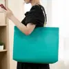Tienda de ropa bolsa portátil no tejida chaqueta de plumas de primavera abrigo estampado supermercado publicidad regalo mochila de compras verde oscuro