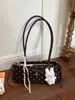 Bolso de axila de moda estilo coreano transfronterizo para mujer, nuevo bolso baguette de lunares con lazo, bolso de hombro y bolso de mano moderno y elegante