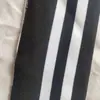 Uniforme Escolar Uniforme de Baseball Listrado Preto e Branco com Punho Mesclado Gola com Barra Canelada Tecido Canelado Calibre 14 Moda
