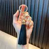 Llavero Colgante con Borla de Cuero Llavero de Coche Encanto para Bolso Adorno de Regalo Pequeño Venta al por Mayor