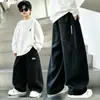 Pantalones de Chándal Anchos Sueltos para Niño Primavera y Otoño Pantalones Largos Deportivos Casuales Nuevo Estilo 2026 Niños Medianos y Grandes Marca de Moda Color Sólido Estilo Versátil