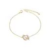 Joia elegante com banho de ouro real e zircônia microincrustada, design de nicho feminino, pulseira de laço, pulseira simples para todas as ocasiões