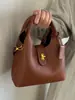 Bolso Cubo de Lujo Vintage de Nicho para Mujer Nuevo Estilo Otoño/Invierno 2025 Versátil para Hombro/Cruzado/Bolso de Mano