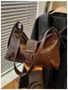 Bolso de Hombro Único Estilo Coreano Bolso Tote para Mujer Otoño 2026 Nuevo Llegada Tacto de Alta Gama Bolso de Motocicleta Bolso Cruzado para el Viaje Diario