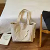 Chegada Nova Outono 2026 Bolsa Tote de Grande Capacidade Bolsa de Mão Feminina Bolsa de Ombro Simples Versátil Bolsa para o Dia a Dia Atacado de Bolsas Femininas