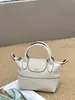 Bolso de Mano de Piel de Vaca Texturizada de Primera Capa Más Vendido Transfronterizo, Bolso Tipo Empanada de Diseño Nicho Estilo Coreano, Bolso Cruzado de Moda para Mujer