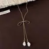 Collar largo ajustable con colgante de lazo estilo ins coreano para mujer, nuevo accesorio popular de cadena para el cuello 2026, cadena para la clavícula