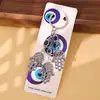 Nuevo llavero transfronterizo con colgante de elefante, palmera y pavo con ojos azules, para bolso o coche.