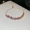 [Cadena de Diamantes Arcoíris] Pulsera de extracción de zircón trenzado en cruz, una pulsera lujosa y de alta gama, una pieza de joyería delicada y de moda