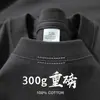 Camiseta Off-Shoulder Manga Curta Algodão Puro de Xinjiang Peso Pesado 300g Azul Klein Tendência Top Branco Solto para Homens e Mulheres Casais