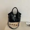 Bolso de mano vintage de alta gama para mujer, nuevo estilo primavera 2026, bolso cruzado y de hombro casual único y moderno