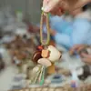 Cascabel Campana de Mano Carrillón Colgante de Bolsa Hecho a Mano Rayo de Sonido Cascabel Colgante Fruta Negra Indonesia Cáscara Fábrica Venta al por Mayor