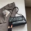 Bolso de Gran Capacidad para Mujer bajo el Brazo 2025 Nuevo Estilo Bolso de Mano Minimalista Francés Texturizado Bolso de Hombro con Cadena Moda Venta al por Mayor