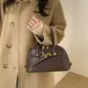 Bolso de Mano Retro de Concha de Gama Alta para Mujer 2026 Nuevo Nicho Versátil para el Trabajo y el Viaje al Trabajo Bolso Tote Pequeño de Hombro Cruzado