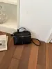 Bolsa Tote Pequena Super Moderna para Escritório Feminina 2026 Nova Primavera Popular Toque de Luxo Bolsa de Ombro Único Bolsa Transversal Balde para o Trabalho