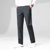 Pantalones casuales gruesos de alta elasticidad para hombre, nuevo estilo otoño e invierno, cintura media-alta elástica, pierna recta estilo papá para hombre
