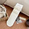 Calcetines de punto de color liso con ribete de encaje hasta la mitad de la pantorrilla estilo Dongdaemun coreano para mujer, estilo japonés de otoño e invierno, calcetines holgados rojos de Ankora dulces y retro