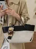 Yue Zi 2026 Outono/Inverno Nova Bolsa Tote Grande Capacidade Versátil de Mão/Ombro Moda Estilo Férias Simples Bolsa para o Dia a Dia