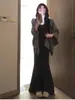 Vestido falda de punto negro estilo cola de pez para mujer, perfecto para llevar debajo de un abrigo en otoño e invierno, un impresionante vestido largo ajustado al cuerpo