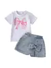 Conjunto de 2 Piezas Verano 2026 de Shorts de Mezclilla, Camiseta de Manga Corta con Estampado Infantil de Color Sólido, Ropa de Playa con Lazo para Niñas