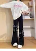 Calça Casual com Barra Micro Flare e Laço para Mulheres 2025 Nova Coleção Primavera Início Design Casual Emagrecedora Calça Comprida