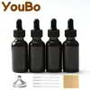Botella gotero de vidrio Boston transparente negro para cosméticos líquidos, aceite esencial, 30 ml, caja de envío transfronterizo