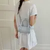 Bolsa de mano casual simple de nuevo estilo para la primavera de 2026, bolsa tote pequeña, bolsa tipo almohada de lunares para mujer, bolsa de hombro único, bandolera