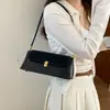 Bolso de mujer 2026 nueva moda versátil bolso de mano retro francés, bolso de hombro para el trabajo, bolso elegante para debajo del brazo