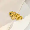Broche de acero inoxidable con forma de águila, diseño creativo europeo y americano, con forma de girasol, estilo angelito, liso y plisado.