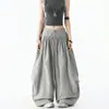 Pantalones de tiro alto drapeados sueltos estilo hip-hop pierna curva para mujer otoño adelgazantes volantes capullo pierna ancha pantalones de baile modernos