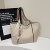 Bolso de hombro casual personalizado de moda, diseño de nicho, bolso nuevo de alta calidad, bolso tote de moda para mujer verano 2026