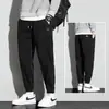 Pantalones de hombre marca de moda ins todo-partido pantalones deportivos primavera, otoño e invierno holgados con tobillo fruncido forro polar cálido casual pants de chándal