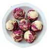Té aromático de bola de dragón Pu'er hecho a mano de Yunnan transfronterizo té de bola de dragón de jazmín venta al por mayor té aromático de bola de dragón flor de rosa y peonía
