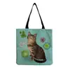 Directo de fábrica estilo coreano bolso de hombro práctico de dibujos animados moda versátil bolsa de mano lindo gato estampado bolsa de compras