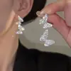 Pendientes de moda de aguja de plata con mariposa de circón superbrillante para mujer 2026 Nuevo estilo Elegantes versátiles Pendientes largos coreanos para mujer