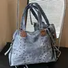 Bolso de mano tipo tote retro de gran capacidad para otoño e invierno 2026 nuevo y moderno, fresco, con remaches, bolso de mano y bolso de hombro versátil