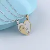 Joyería transfronteriza collar de hombre corazón de amor gato pareja costura un par de colgantes colgantes adornos simples de acero inoxidable