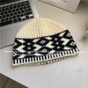 Gorro de punto de diseñador de Corea del Sur para mujer, gorro de lana vintage de mezcla de lana para otoño e invierno, cálido, con protección para las orejas y frío.