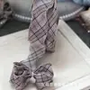 Otoño e invierno Nuevo material de lazo Pinza para el pelo estilo británico para niños Tela a cuadros de doble cara